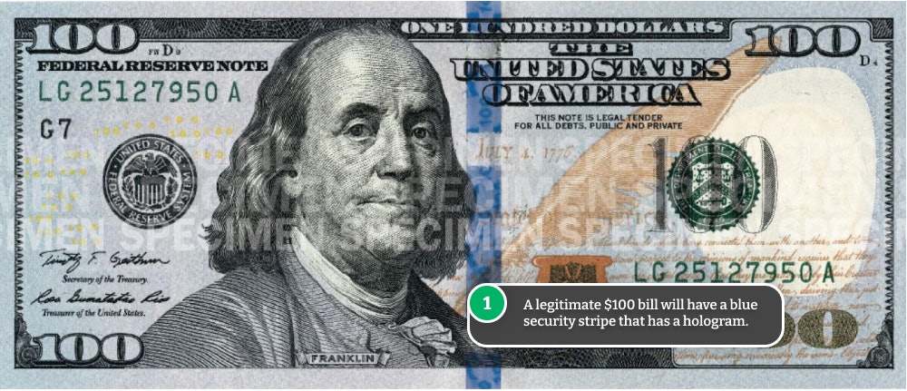 Security stripe on a hundred dollar bill.